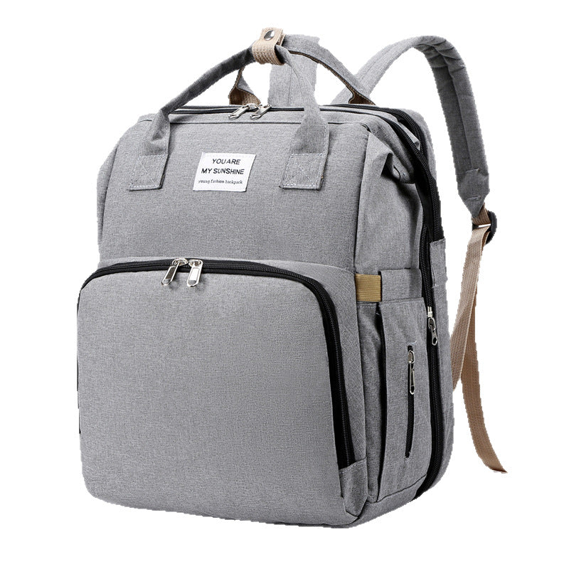 CarryAll 55L capacity diaper bag, fits diapers wipes clothes laptop