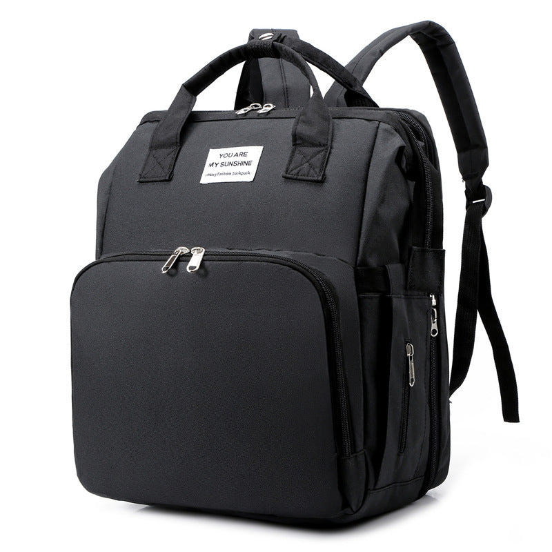 CarryAll tote worn as backpack by new mother on outing