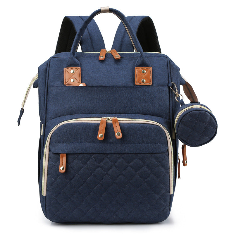 NestGo diaper bag worn by mother, ergonomic back support